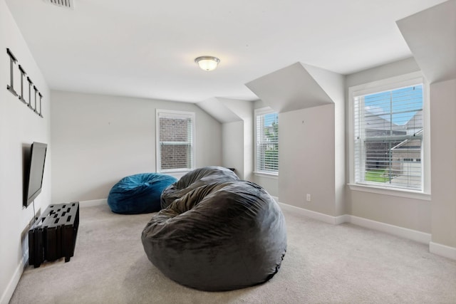 sitting room featuring light colored carpet