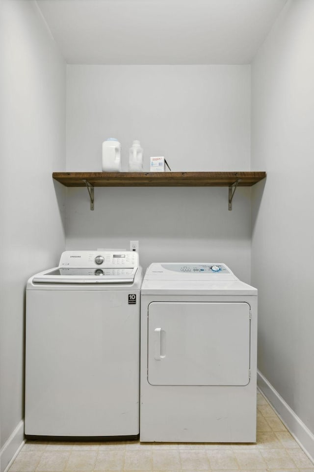 clothes washing area with independent washer and dryer