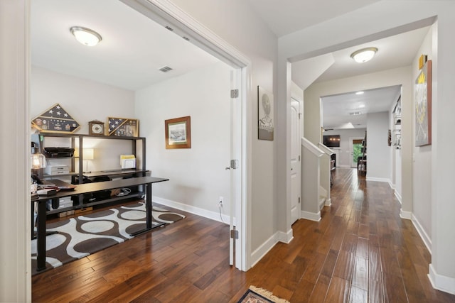 hall with dark wood-type flooring