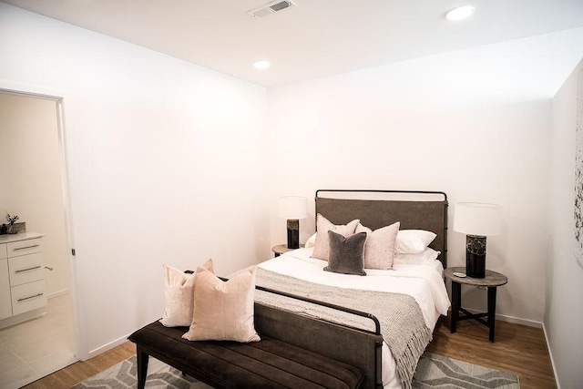 bedroom with wood-type flooring