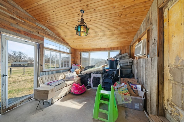 sunroom / solarium with a wall mounted air conditioner, vaulted ceiling, and wooden ceiling