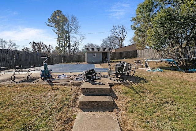 view of yard featuring a patio and a storage unit