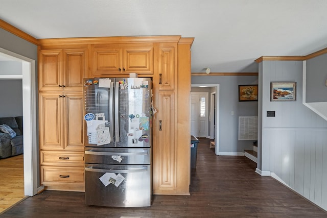 kitchen featuring crown molding, stainless steel fridge, wooden walls, and dark wood-type flooring