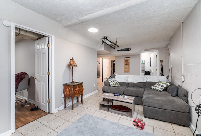 tiled living room with a textured ceiling