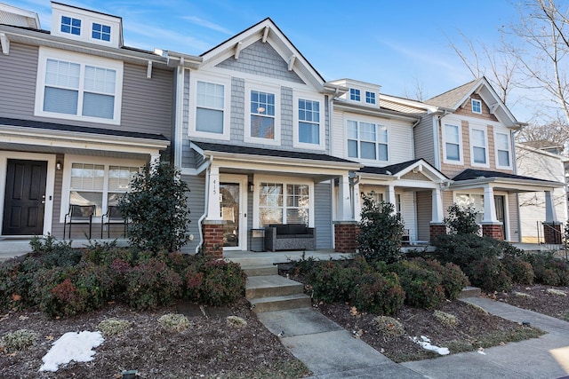 townhome / multi-family property with covered porch