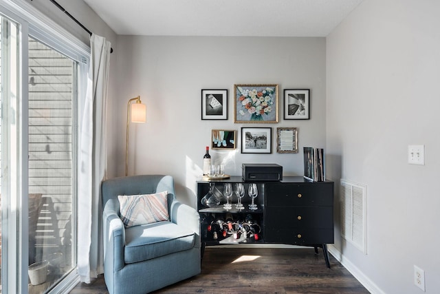 sitting room with dark hardwood / wood-style floors