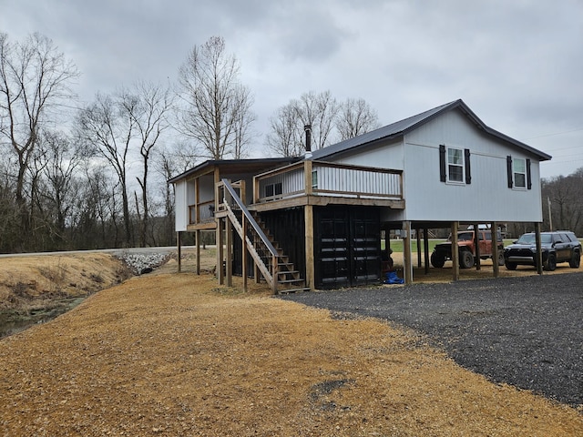 back of property featuring a deck