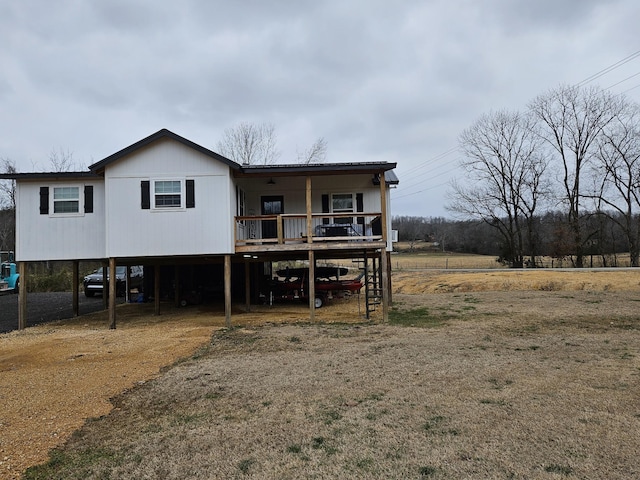 back of property featuring covered porch