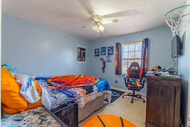 carpeted bedroom with ceiling fan and a textured ceiling