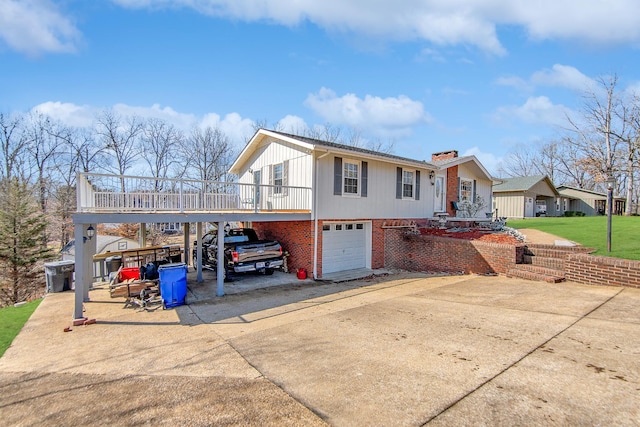 view of front of property with a carport and a garage