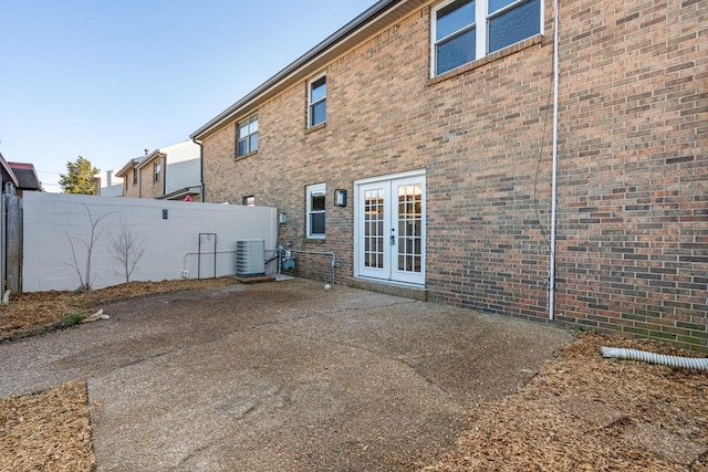 back of house featuring central AC unit, a patio area, and french doors