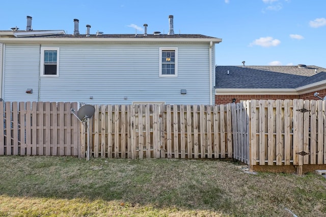 rear view of house with a lawn