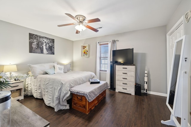 bedroom with dark wood-type flooring and ceiling fan