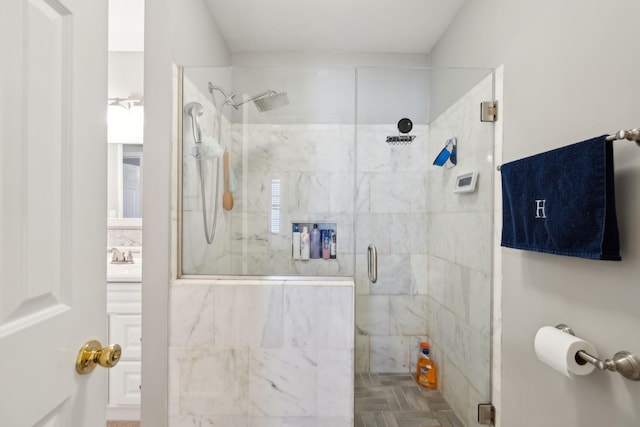 bathroom with a shower with door