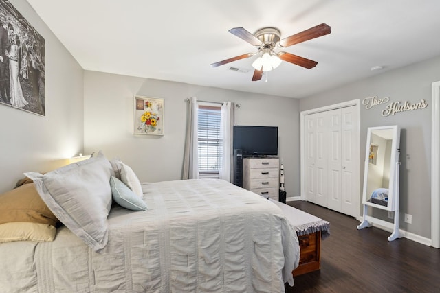 bedroom with ceiling fan, dark hardwood / wood-style floors, and a closet