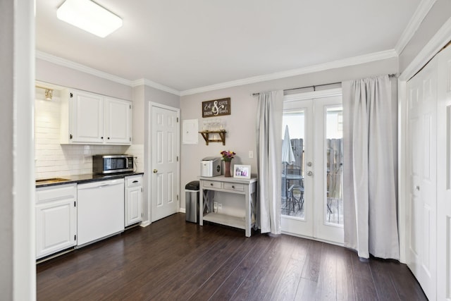 kitchen with decorative backsplash, dishwasher, white cabinets, and french doors