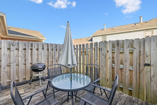 wooden balcony with area for grilling and a wooden deck