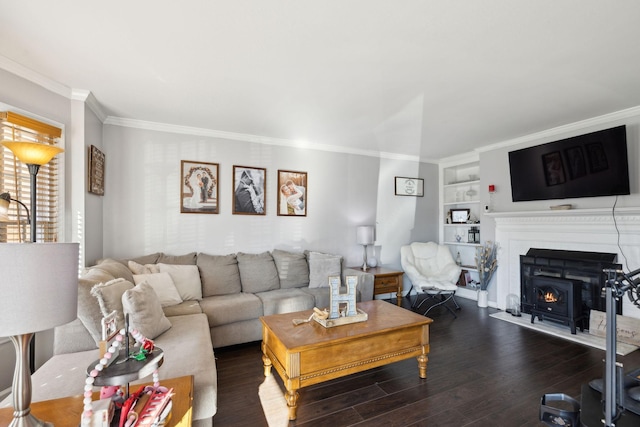 living room featuring ornamental molding, built in features, and dark hardwood / wood-style flooring