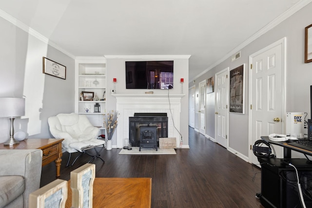 living room featuring crown molding, dark wood-type flooring, and built in features