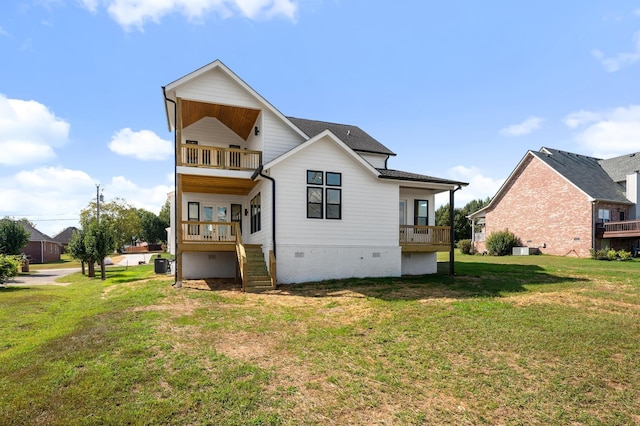 back of house with central AC unit, a yard, and a balcony