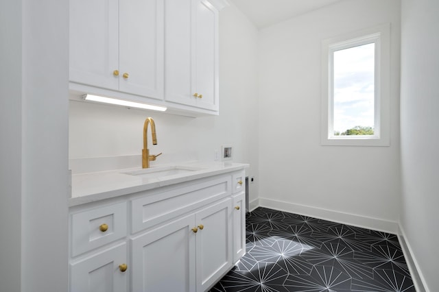 laundry area featuring washer hookup, hookup for an electric dryer, and sink