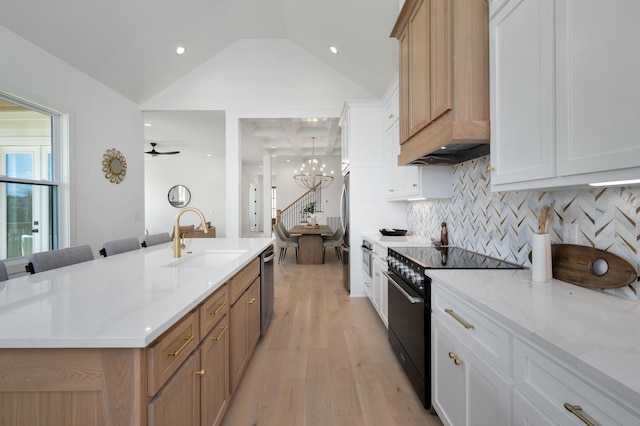 kitchen with white cabinetry, a spacious island, and appliances with stainless steel finishes