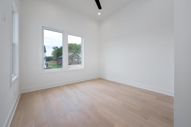 spare room with ceiling fan and light hardwood / wood-style flooring