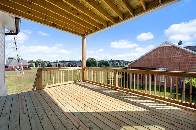wooden deck with a yard