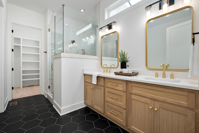 bathroom with vanity and a shower with shower door