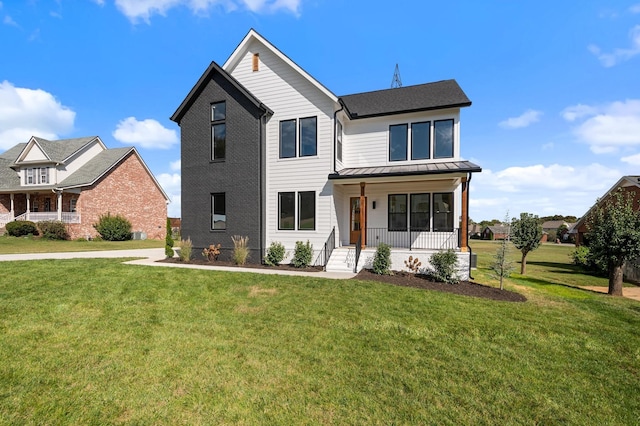 view of front facade featuring a porch and a front lawn