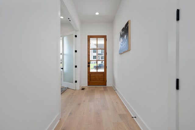 entryway with light hardwood / wood-style floors