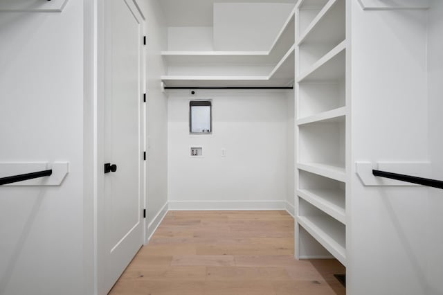 walk in closet featuring light hardwood / wood-style floors