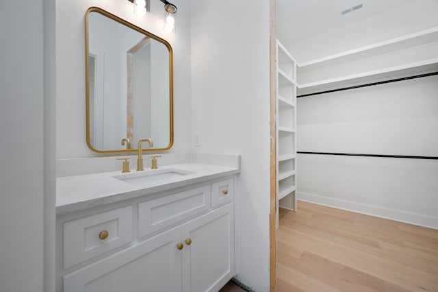 bathroom featuring vanity and hardwood / wood-style floors