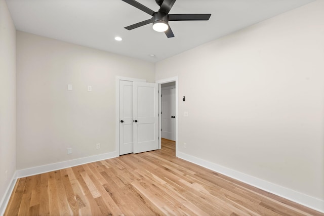 empty room featuring ceiling fan and light wood-type flooring