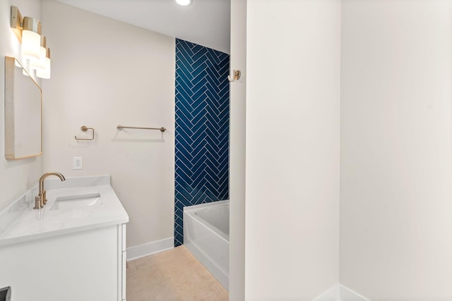 bathroom with tile patterned floors and vanity