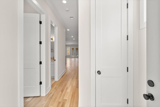 hallway with light wood-type flooring