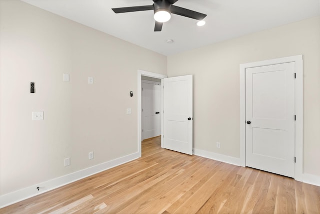 unfurnished bedroom featuring ceiling fan and light hardwood / wood-style floors