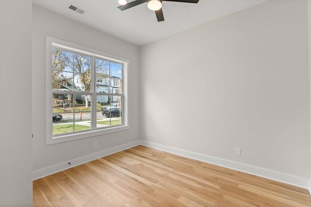 empty room with light hardwood / wood-style flooring and ceiling fan