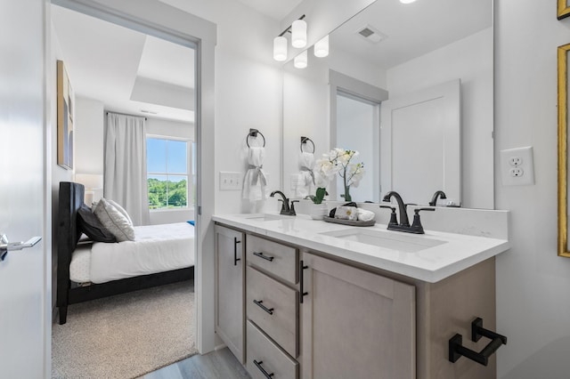 bathroom with vanity and hardwood / wood-style floors