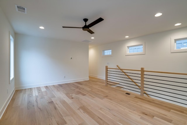 interior space with ceiling fan, plenty of natural light, and light wood-type flooring