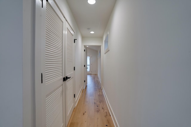 corridor with light wood-type flooring