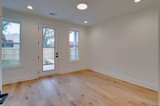 doorway to outside with light hardwood / wood-style floors