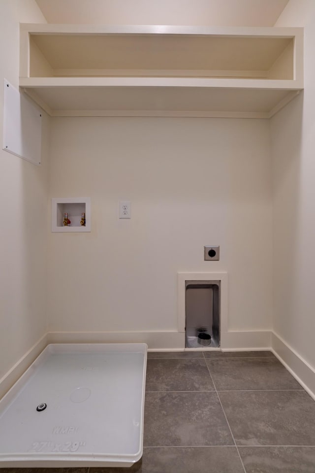 laundry area with washer hookup, dark tile patterned floors, and electric dryer hookup