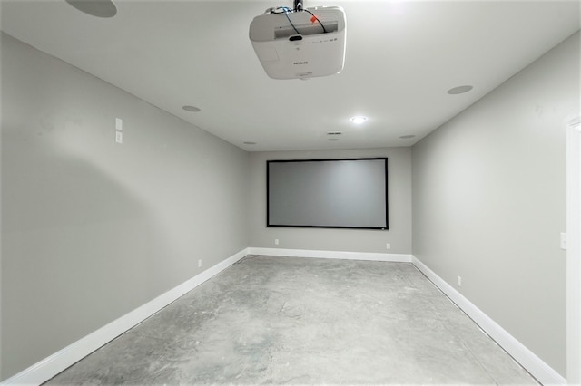 home theater room with concrete floors