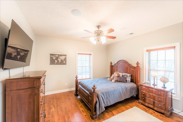 bedroom featuring ceiling fan and light hardwood / wood-style flooring