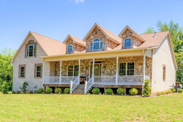 view of front of home featuring covered porch and a front yard