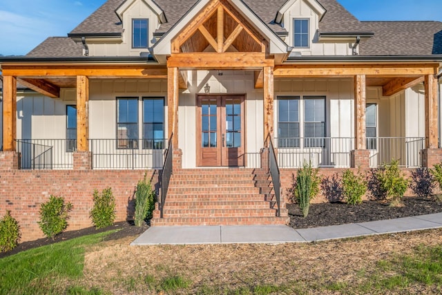 view of front of property with french doors and a porch