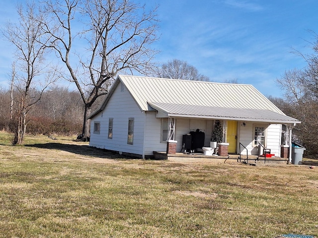 exterior space with a yard and covered porch