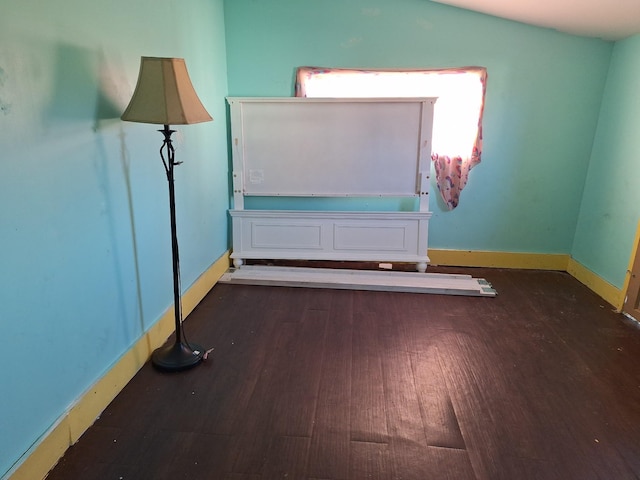 empty room featuring dark hardwood / wood-style flooring