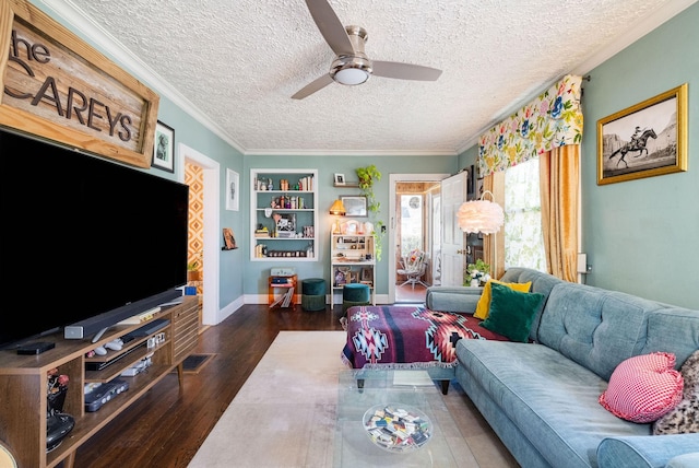 living room with ornamental molding, dark wood-type flooring, built in features, and a textured ceiling